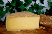 Wedge of French cheese Tomyere Montagne AOP 14 Months