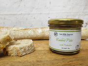 French Rabbit Pistachio Pâtés with baguette on a charcuterie board