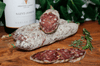 Herbes de provence Saucisson Sec. Aged French Salami made with Free Range Pork on a chopping board