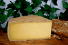 Wedge of French cheese Tomyere Montagne AOP 14 Months